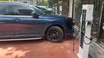 A vehicle charging at a station.