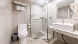 A modern bathroom with a glass-enclosed shower, a white sink, and a toilet. - Jinjiang Inn Fashion Chongqing Jiangbei Liyuchi Changan Automobile (Chongqing)