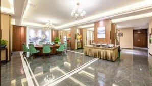 A hotel lobby with a dining area, a reception desk, and a chandelier. - Jinjiang Inn Fashion Chongqing Jiangbei Liyuchi Changan Automobile (Chongqing)