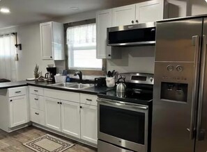 Microwave, coffee/tea maker, cookware/dishes/utensils