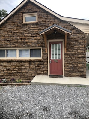 Stunning stone exterior with a charming entrance and small porch.