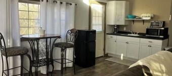 The Cubby Hollow w hot tub in the quaint village of Aurora