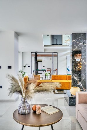 Exclusive Villa, 4 Bedrooms | Living area | 49-inch Smart TV with satellite channels, TV, fireplace