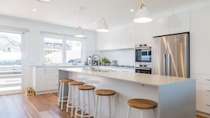 Dishwasher, coffee/tea maker, dining tables