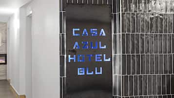 A sign for "CASA AZUL HOTEL" with a modern design.