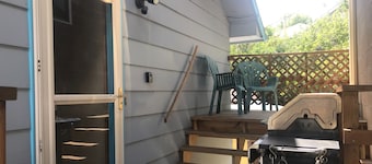 Covered parking/3 bedrooms, sitting room, restroom w/laundry, full kitchen, deck