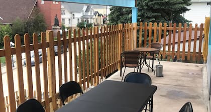 Covered parking/3 bedrooms, sitting room, restroom w/laundry, full kitchen, deck