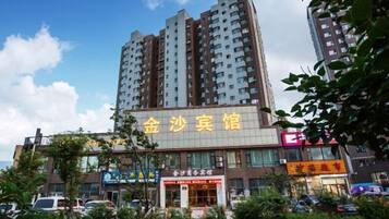 A multi-story building with a prominent sign for a restaurant.