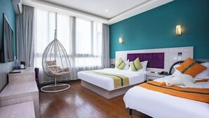 A hotel room with two beds, a hanging chair, a desk, and a TV. - Changchun Jinsha Hotel (Changchun)