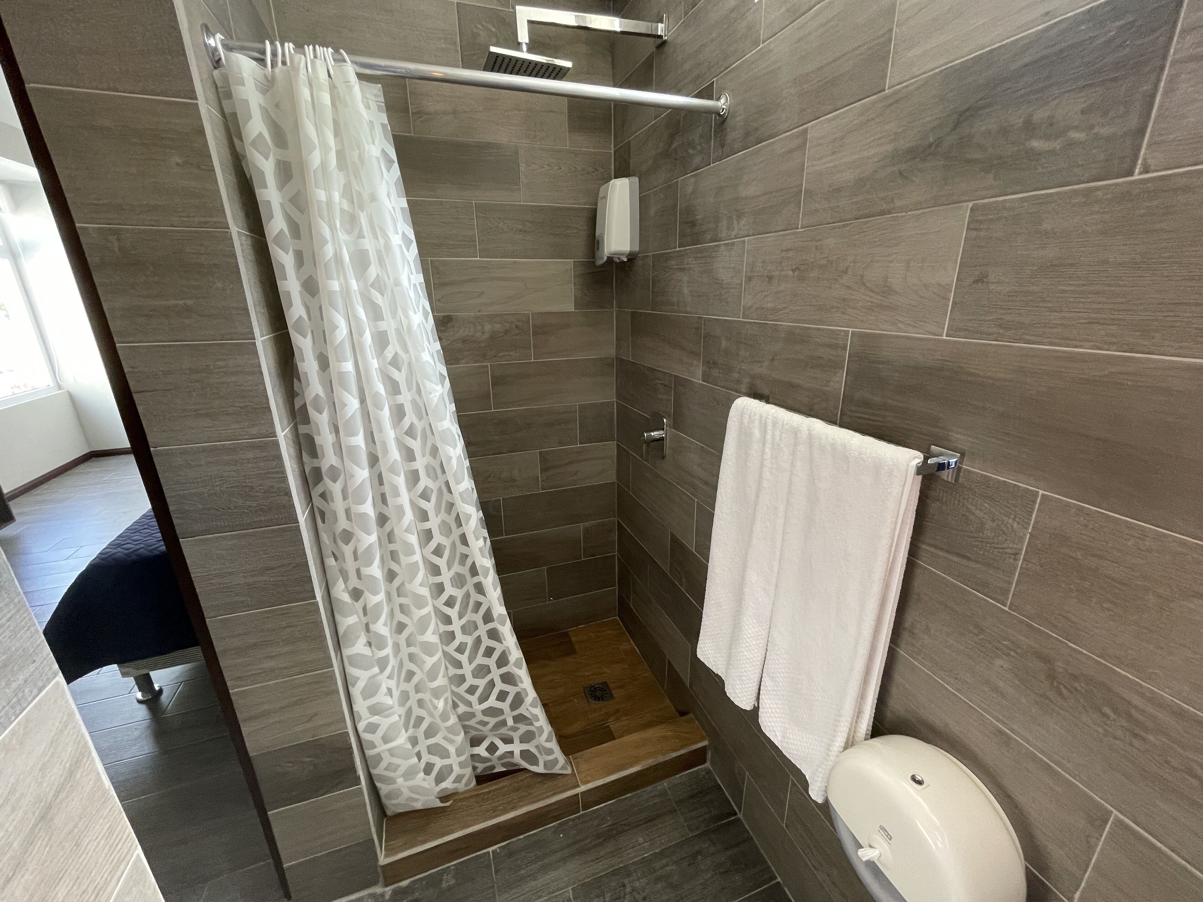 economy double room, 2 queen beds | bathroom | shower, free toiletries, towels, soap