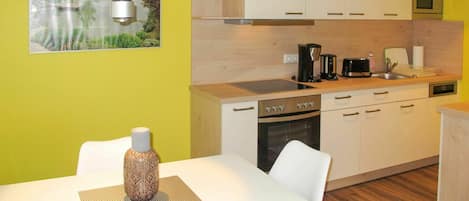 Microwave, dishwasher, toaster, dining tables