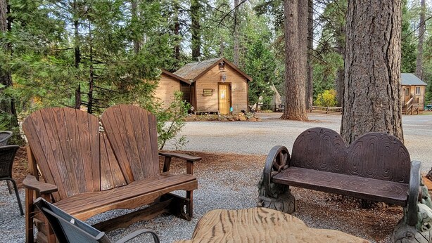 A rustic cabin with a wooden door and a sign reading "B&B Laundry."