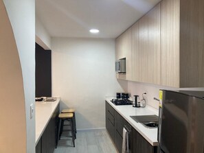 Fridge, microwave, stovetop, coffee/tea maker