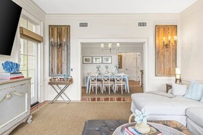 A hotel room with a bed, a desk, and a dining area. - Ave 30A - 2BR/2BA WaterColor Town Center Condo - Sleeps 4 - Beach Club Access (Santa Rosa Beach)