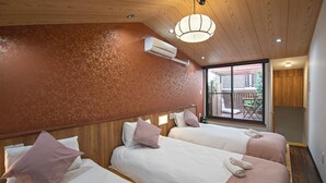 A hotel room with two beds, a wooden ceiling, an air conditioning unit, and a view of the outside balcony. - miyu Ebisu Independent Japanese hotel (Osaka)