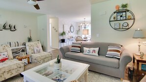 A living room with a sofa, chairs, a coffee table, and a ceiling fan. - Ocean View Escape ~ 4 Miles to Bethany Beach! (Ocean View)