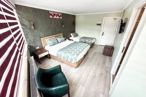 Family Triple Room | Hypo-allergenic bedding, minibar, in-room safe, desk