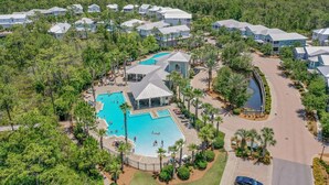 A resort with multiple buildings, a central swimming pool, and a surrounding natural landscape. - ☀️2 Masters~2 Golf Carts Included~6 Bikes~Pools~Last Call at NatureWalk 30A (Santa Rosa Beach)