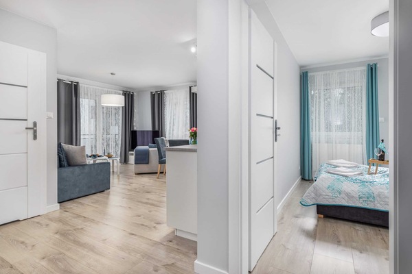 View from the hallway to the living room and cosy bedroom,