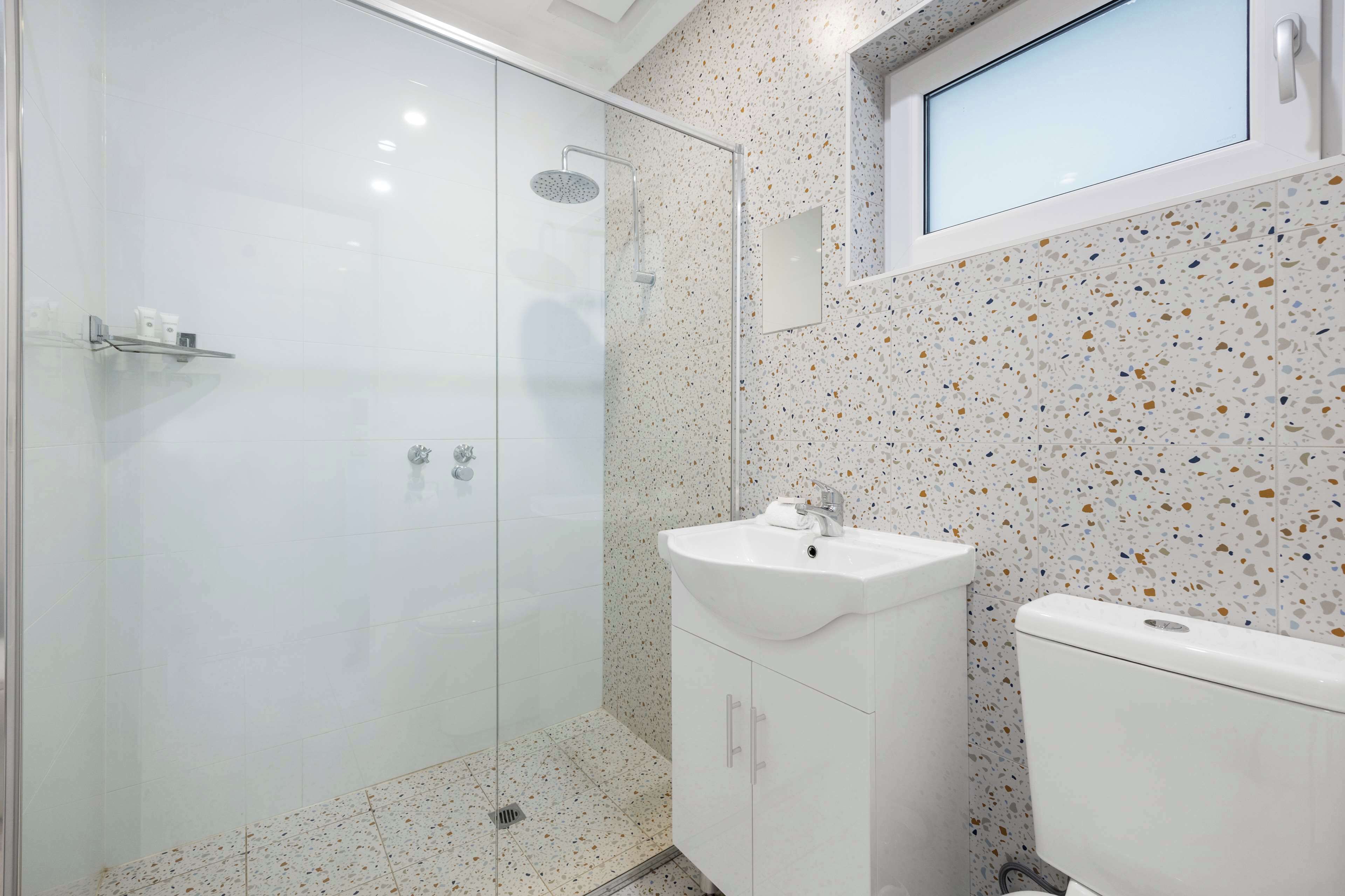 family room, multiple beds | bathroom | shower, rainfall showerhead, hair dryer, towels