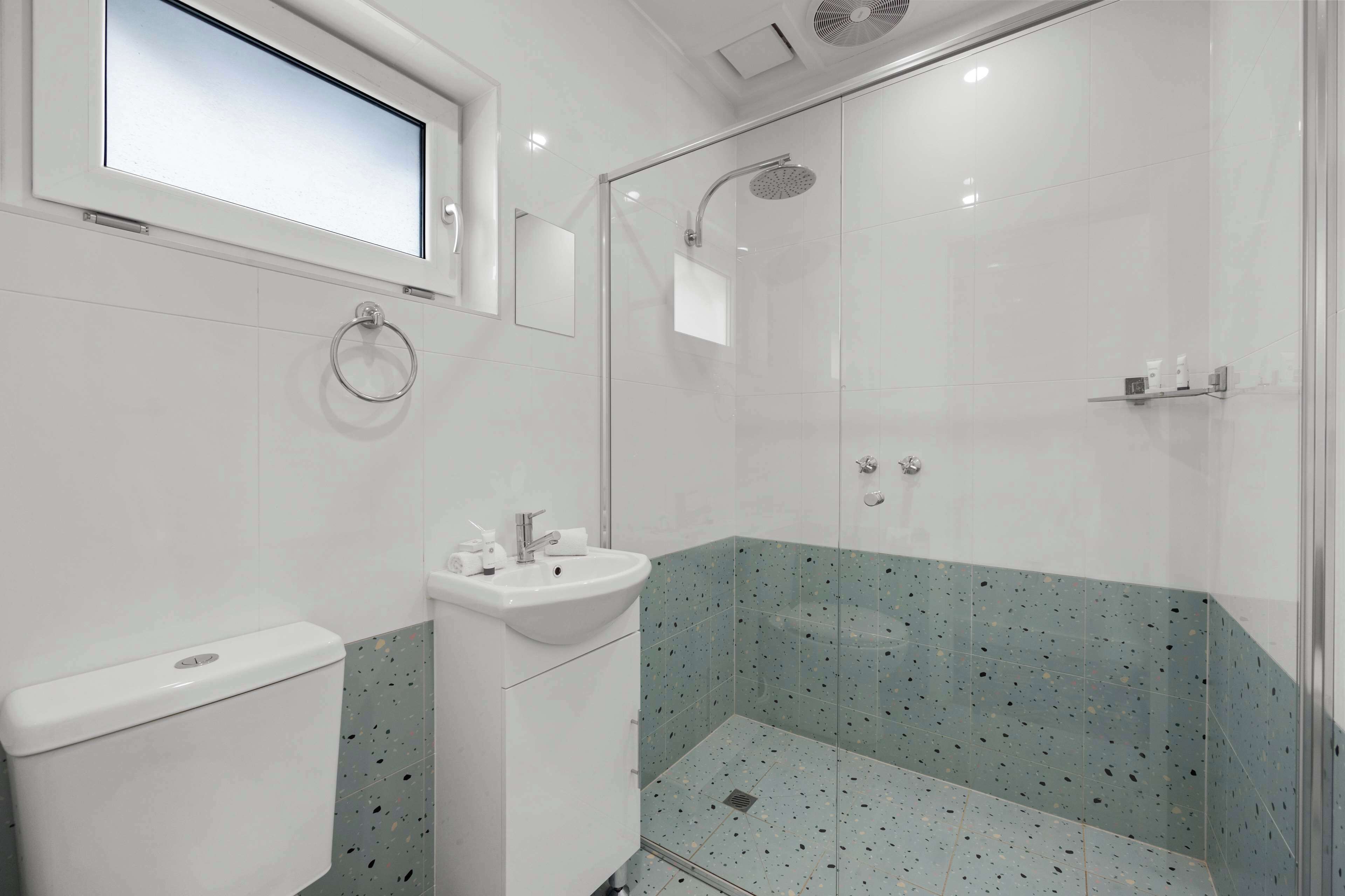 shower, rainfall showerhead, hair dryer, towels