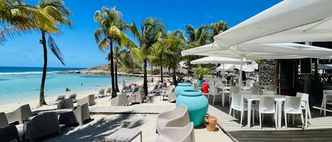 On the beach, sun-loungers, beach towels