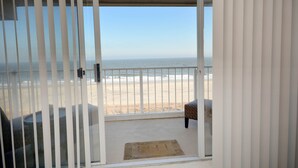 A balcony with a view of the beach and ocean. - Enjoy the beautiful view of the Ocean from this one bedroom condo located in midtown! (Ocean City)