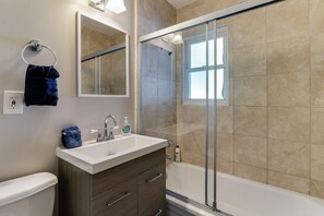 Combined shower/tub, hair dryer, towels, soap