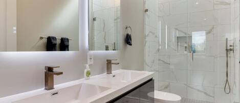 Combined shower/tub, hair dryer, towels, soap