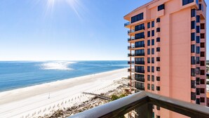 A high-rise hotel with a beach view, featuring balconies and a clear sky. - SeaChase 1005C by Liquid Life (Orange Beach)