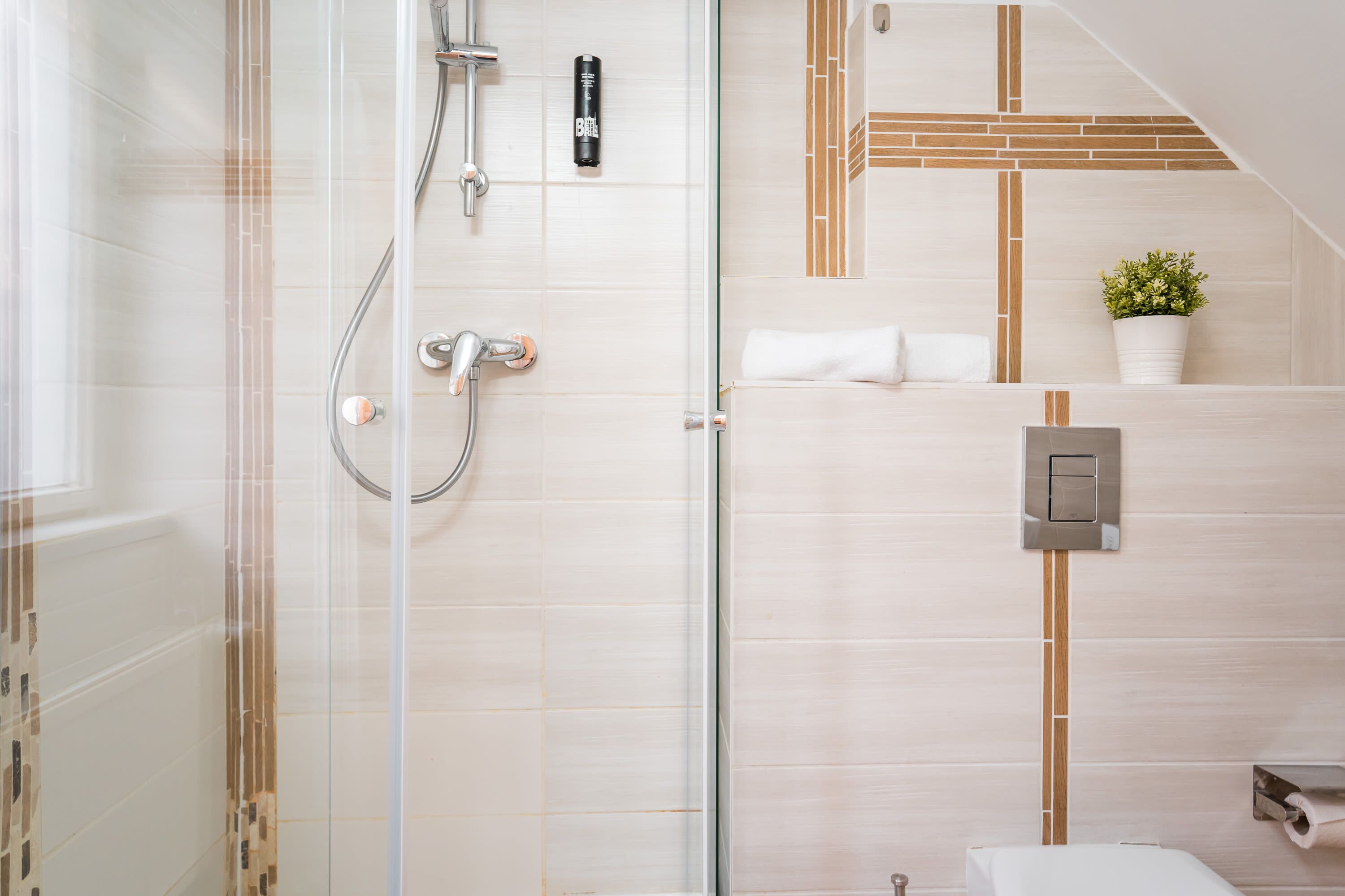 Shower, rainfall showerhead, hair dryer, towels