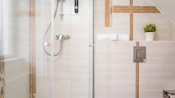 Shower, rainfall showerhead, hair dryer, towels