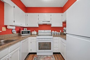 Coffee/tea maker, fridge, microwave, oven