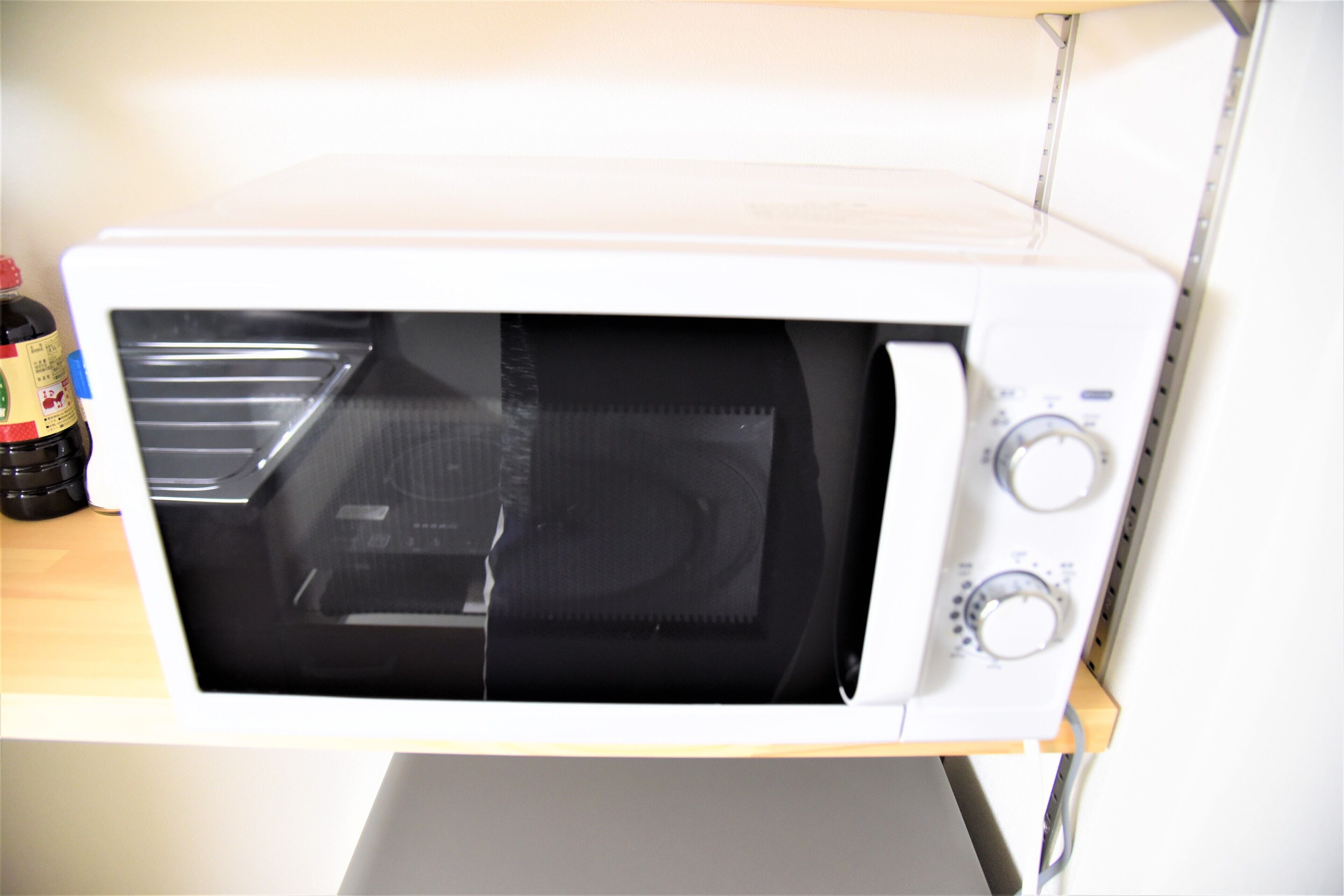 A white microwave oven with a control panel on the right side.