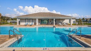 A swimming pool with a building in the background, a clear sky, and a '4 FT' depth marker. - BEAUTIFUL 3BD 2.5BA TOWNHOME, POOL, GYM  by BHOF (Naples)