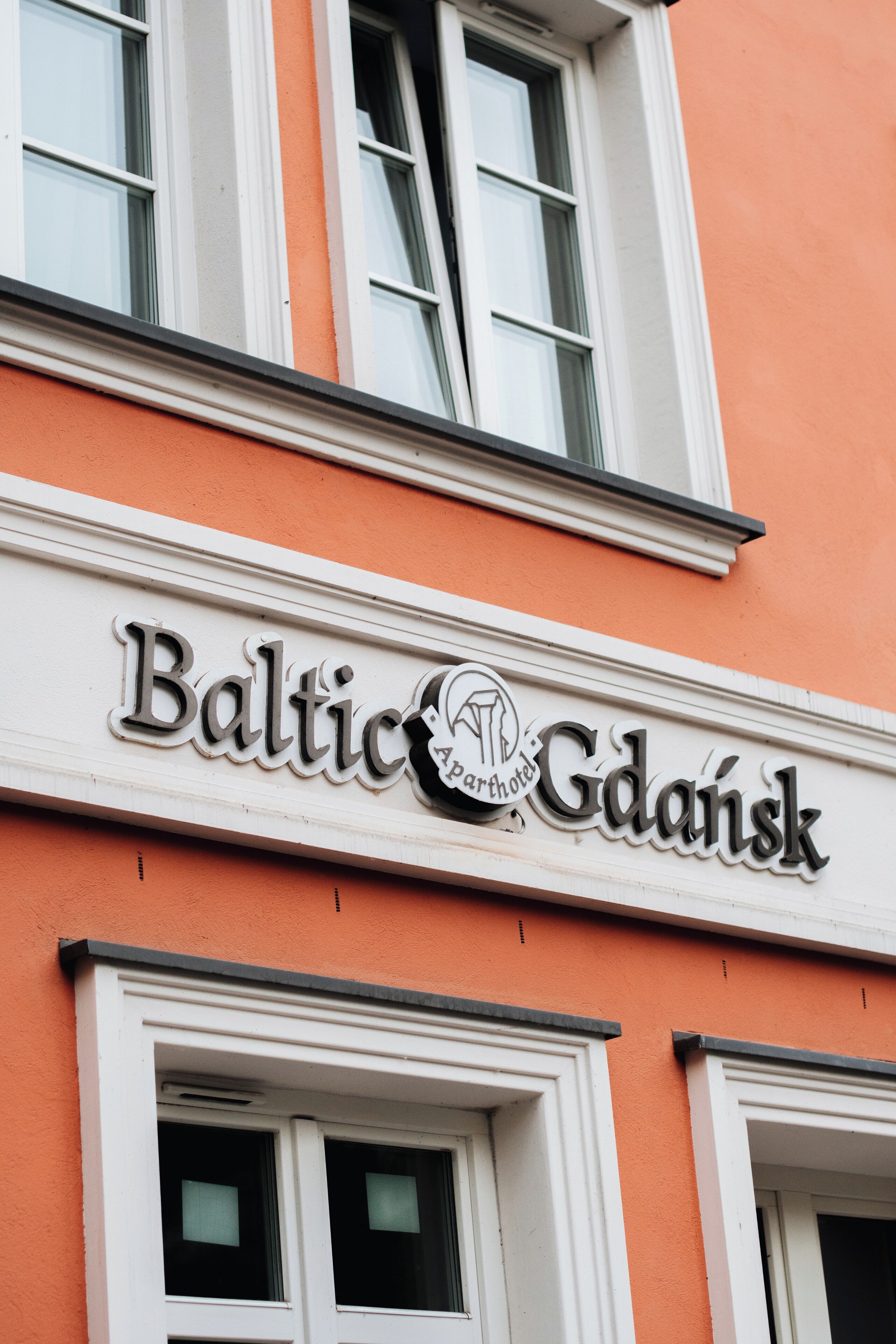 A building with a sign that reads "Baltic Gdansk."
