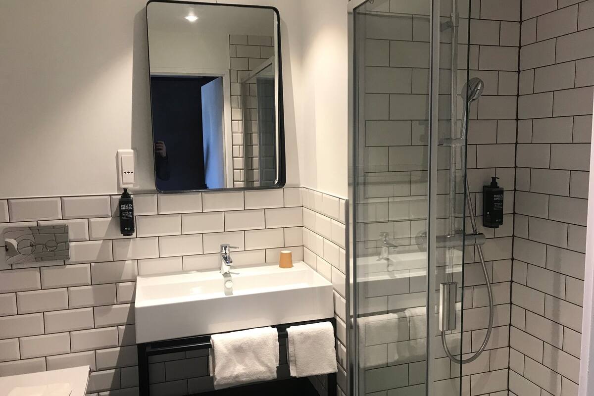 shower, eco-friendly toiletries, hair dryer, towels