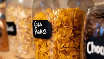 A shelf with jars labeled "Corn Flakes" and "Chocolate."