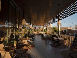 Breakfast, lunch, dinner served; international cuisine, pool views 