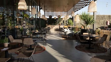 Breakfast, lunch, dinner served; international cuisine, pool views