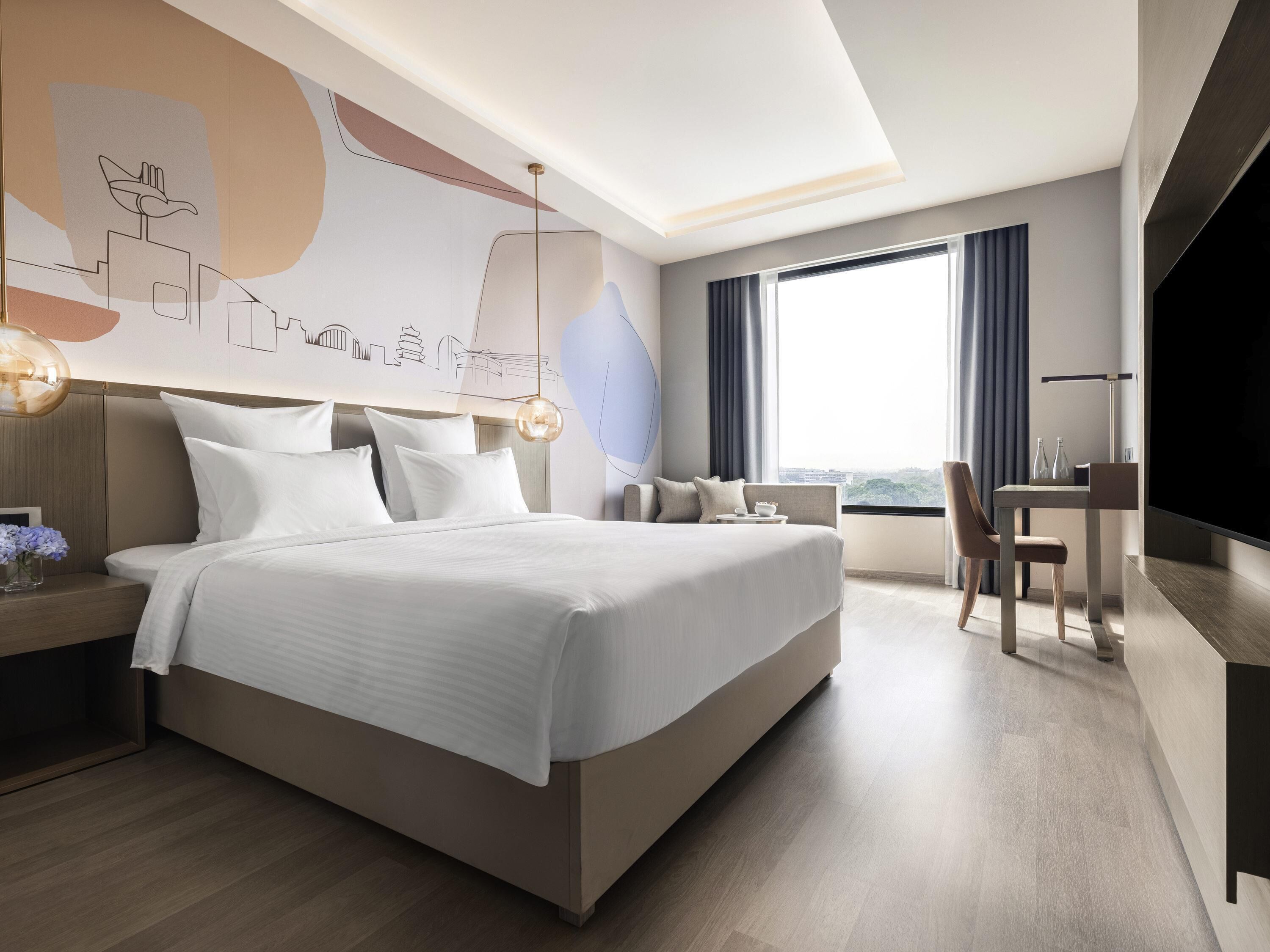 Habitación ejecutiva, 1 cama de matrimonio grande | Minibar, caja fuerte, escritorio y sistema de insonorización