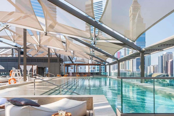Outdoor pool, open 6:00 AM to 10:00 PM, pool umbrellas, sun loungers