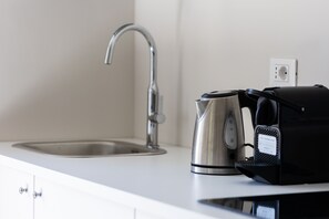 Microwave, stovetop, coffee/tea maker, electric kettle