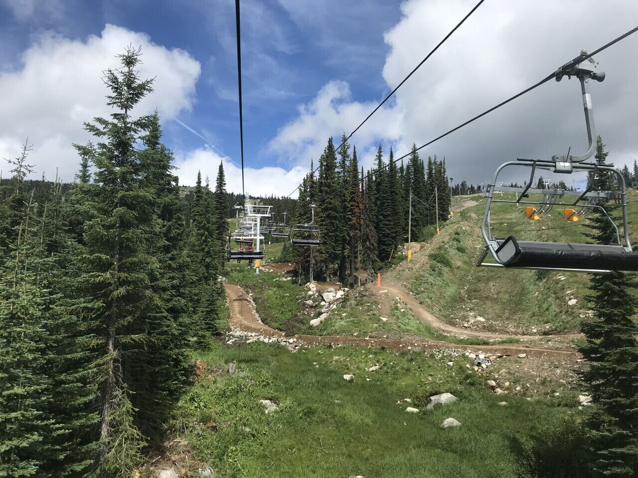 A ski lift with a chairlift and a mountain path.