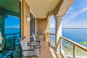 Enjoy a peaceful ocean view from this balcony with a seating area.