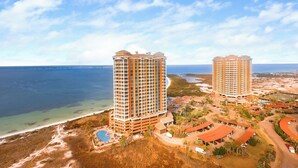A resort with two tall buildings, a beach, and a pool area. - 20th Floor*Stunning Views at Portofino P5-2006 (Pensacola Beach)