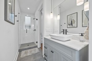 Combined shower/tub, hair dryer, towels, soap