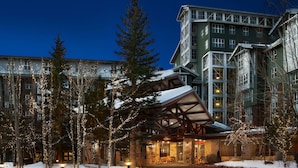 A hotel with a stone facade, a covered outdoor seating area, and a modern building in the background. - 2 Bedroom - Marriott's MountainSide at Park City - Full Resort Access (Park City)