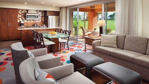 A modern kitchen with a dining area, a sofa, and a view of the outdoors. - 1 Bedroom - Marriott's Shadow Ridge II - The Enclaves - Full Resort Access (Palm Desert)