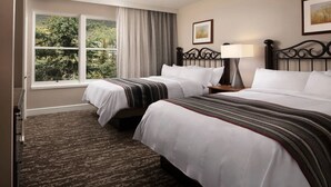 A hotel room with two beds, a large window with a view of trees, a lamp, and a framed picture on the wall. - Studio - Marriott's StreamSide at Vail - Birch, Douglas, and Evergreen - Full Resort Access (Vail)